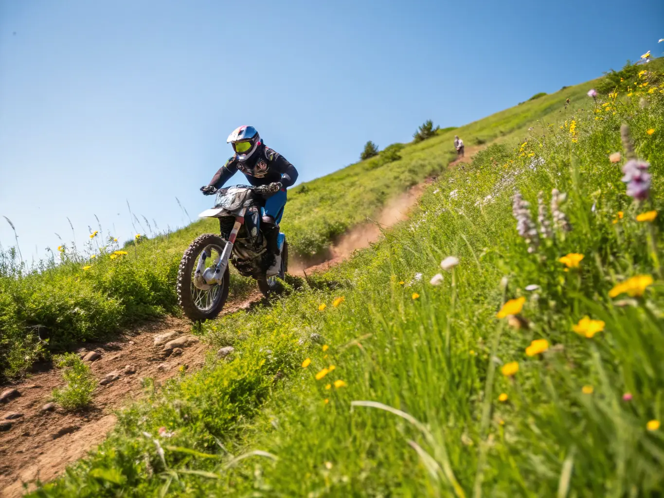 A dynamic action shot of a motocross rider skillfully navigating a dirt track, showcasing the excitement and skill involved in motocross events organized by LES CHEVALIERS DES SOUPAPES.